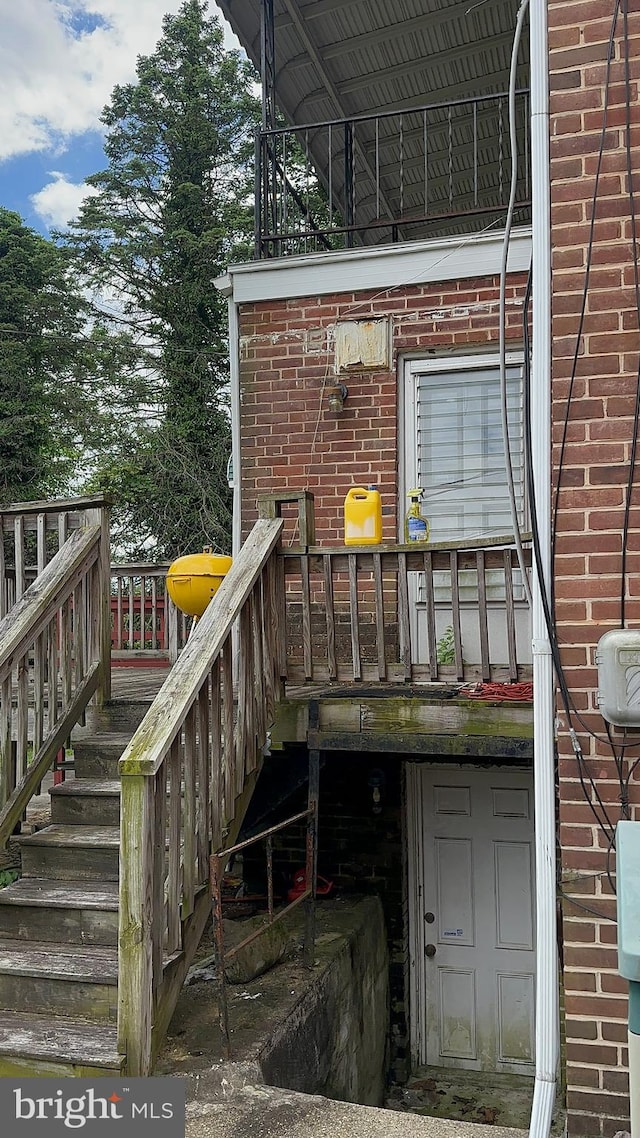 3707 Howard Park Ave, Baltimore, MD 21207 - doorway to property with brick siding and a wooden deck