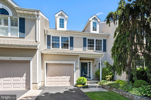 13 Honey Locust Ln, Newtown, PA 18940 - townhome / multi-family property with an attached garage and driveway