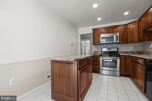 13 Honey Locust Ln, Newtown, PA 18940 - kitchen with stainless steel appliances, light tile patterned flooring, a center island, tasteful backsplash, and recessed lighting