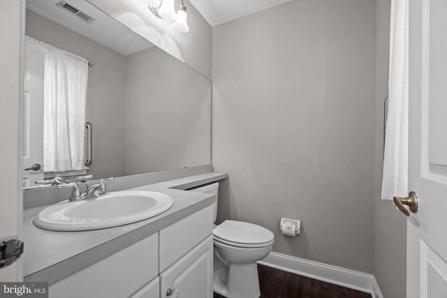 13 Honey Locust Ln, Newtown, PA 18940 - bathroom with vanity, baseboards, toilet, and wood finished floors