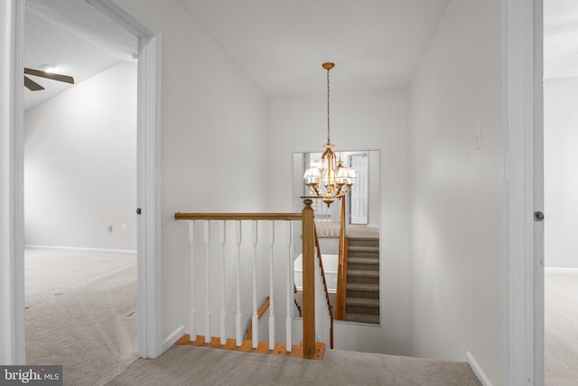13 Honey Locust Ln, Newtown, PA 18940 - staircase featuring a chandelier, carpet flooring, baseboards, and a ceiling fan