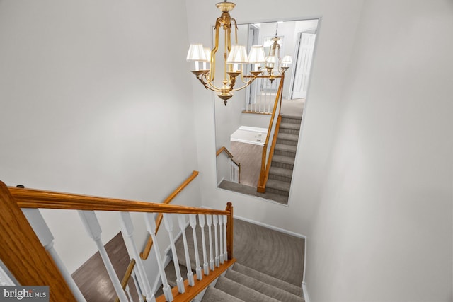 13 Honey Locust Ln, Newtown, PA 18940 - staircase featuring a chandelier and baseboards