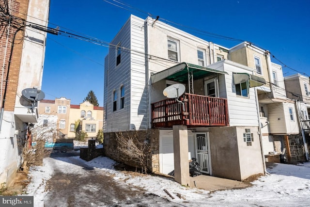 6982 Clinton Rd, Upper Darby, PA 19082 - snow covered rear of property with a balcony