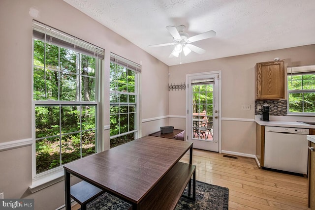 3218 Water Lily Ct, Laurel, MD 20724 - dining space featuring light wood-type flooring, ceiling fan, and a textured ceiling