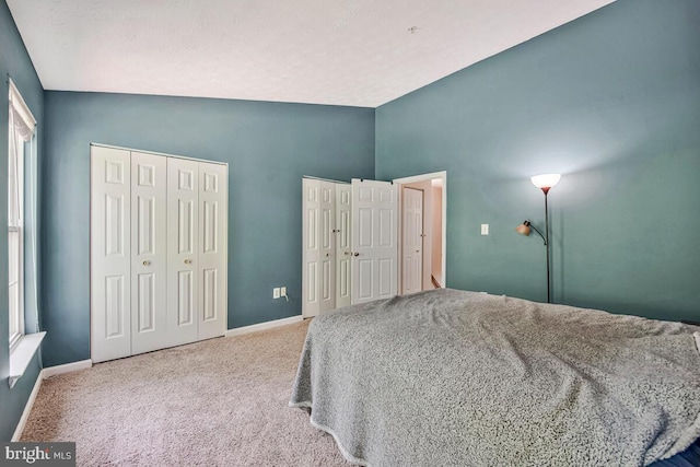 3218 Water Lily Ct, Laurel, MD 20724 - carpeted bedroom with multiple closets, lofted ceiling, and baseboards