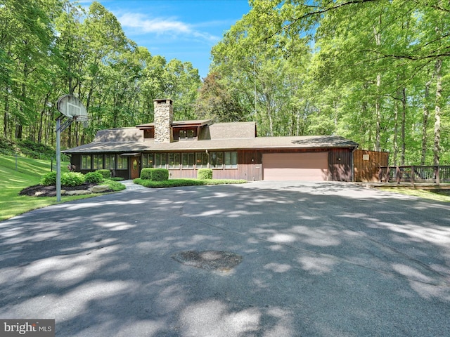 2511 W Norwegian St, Pottsville, PA 17901 - view of front of house with a garage, a chimney, and driveway