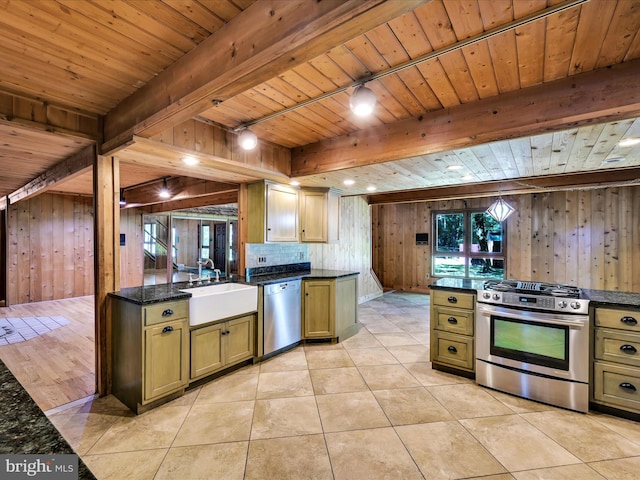2511 W Norwegian St, Pottsville, PA 17901 - kitchen featuring stainless steel appliances, a sink, wood ceiling with exposed beams, wood walls, and light tile patterned floors