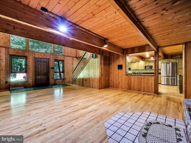 2511 W Norwegian St, Pottsville, PA 17901 - unfurnished living room featuring hardwood / wood-style flooring, wood walls, rail lighting, and wooden ceiling with exposed beams