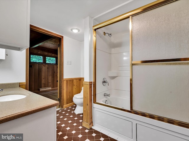 2511 W Norwegian St, Pottsville, PA 17901 - full bathroom with toilet, wainscoting, vanity, wooden walls, and washtub / shower combination