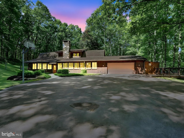 2511 W Norwegian St, Pottsville, PA 17901 - view of front facade featuring a garage, driveway, and a chimney