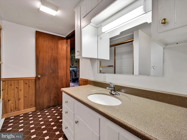 2511 W Norwegian St, Pottsville, PA 17901 - bathroom with wainscoting, vanity, and wood walls