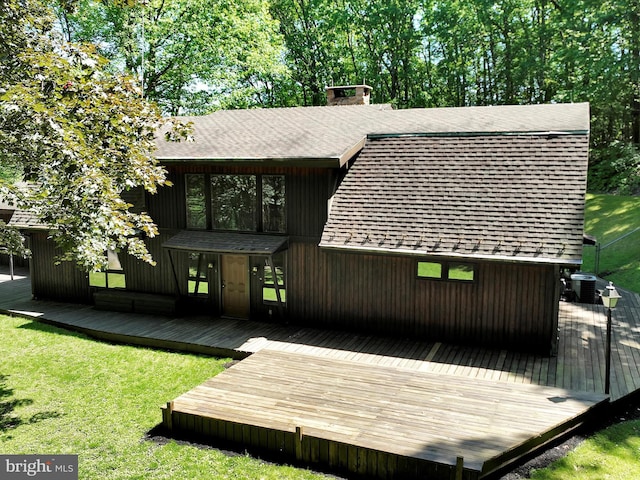 2511 W Norwegian St, Pottsville, PA 17901 - rear view of property featuring a deck, a shingled roof, and a yard