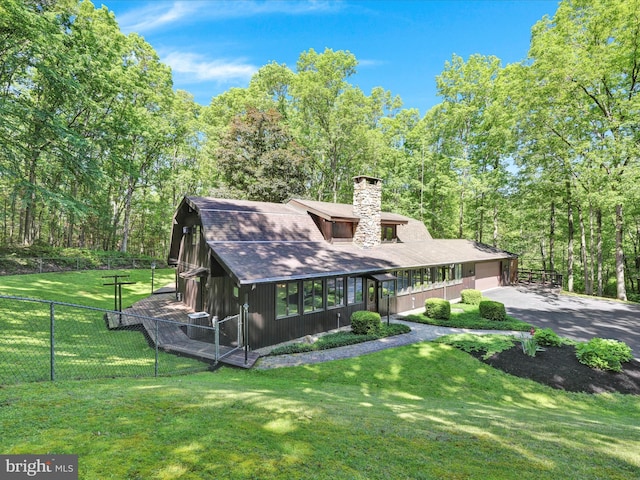 2511 W Norwegian St, Pottsville, PA 17901 - view of front of house with a chimney, asphalt driveway, an attached garage, and a shingled roof