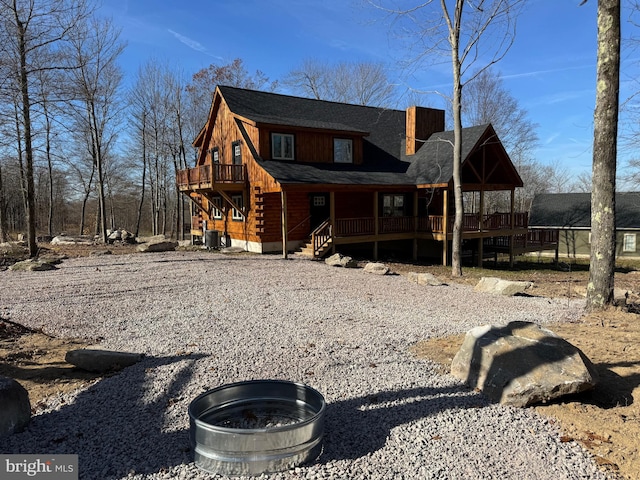 68 Taylor Ln, Mc Henry, MD 21541 - rear view of house with log exterior, covered porch, central AC unit, stairway, and a chimney