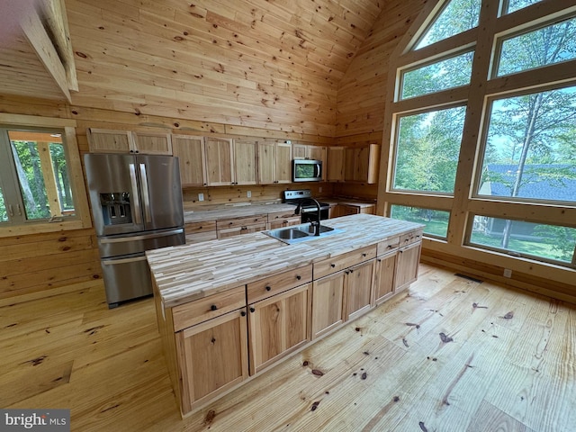 68 Taylor Ln, Mc Henry, MD 21541 - kitchen with stainless steel appliances, high vaulted ceiling, wooden counters, light wood-type flooring, and light brown cabinetry