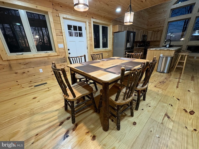 68 Taylor Ln, Mc Henry, MD 21541 - dining room featuring wood ceiling, wood walls, light wood-style floors, and vaulted ceiling