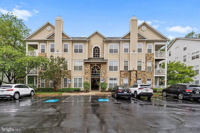 5948 Founders Hill Dr Unit 301, Alexandria, VA 22310 - view of building exterior with uncovered parking