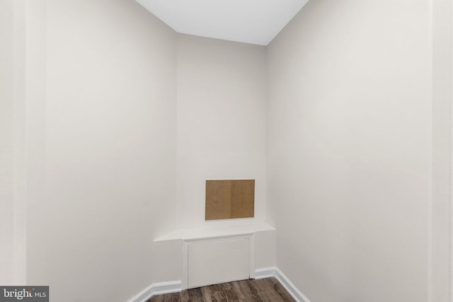 5948 Founders Hill Dr Unit 301, Alexandria, VA 22310 - laundry area with dark wood-type flooring and baseboards