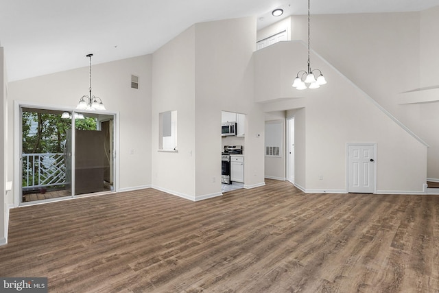 5948 Founders Hill Dr Unit 301, Alexandria, VA 22310 - unfurnished living room with a chandelier, high vaulted ceiling, wood finished floors, and baseboards