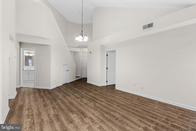 5948 Founders Hill Dr Unit 301, Alexandria, VA 22310 - unfurnished living room with wood finished floors, baseboards, high vaulted ceiling, and a chandelier