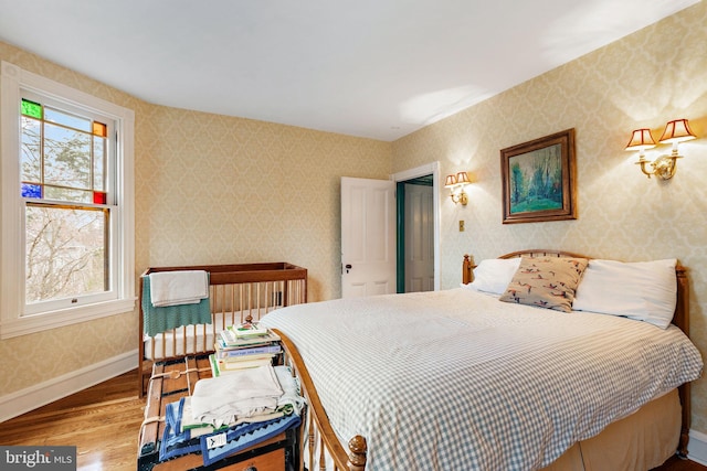 127 Webster Ave, Wyncote, PA 19095 - bedroom with wood finished floors, baseboards, and wallpapered walls