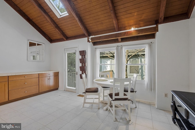 11174 Glade Dr, Reston, VA 20191 - dining room with wooden ceiling, a skylight, light tile patterned floors, and plenty of natural light