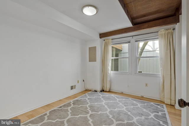 11174 Glade Dr, Reston, VA 20191 - empty room with wood finished floors, beam ceiling, and baseboards