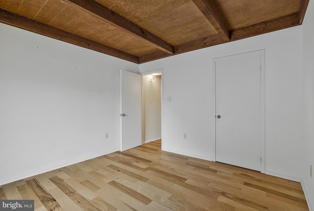 11174 Glade Dr, Reston, VA 20191 - unfurnished bedroom with light wood-type flooring and wooden ceiling with exposed beams