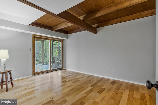 11174 Glade Dr, Reston, VA 20191 - spare room featuring wooden ceiling with exposed beams, light wood-type flooring, and baseboards