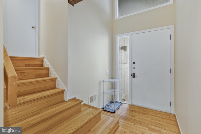 11174 Glade Dr, Reston, VA 20191 - entrance foyer with stairway, wood finished floors, and baseboards