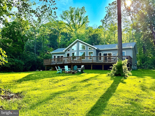 1820 Gooney Manor Loop, Bentonville, VA 22610 - back of property with a deck, an outdoor fire pit, a yard, and a shingled roof