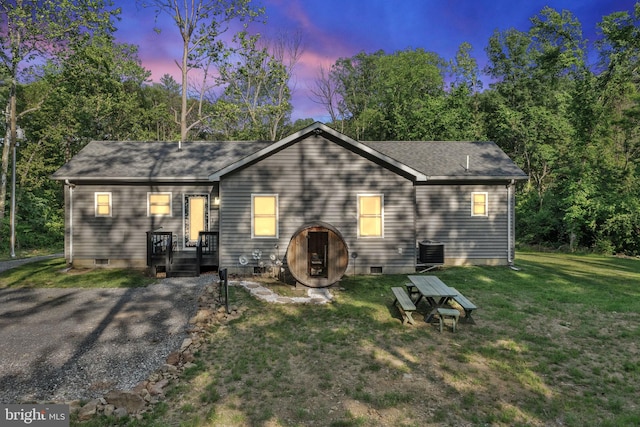 1820 Gooney Manor Loop, Bentonville, VA 22610 - back of property at dusk featuring crawl space, a lawn, and a shingled roof