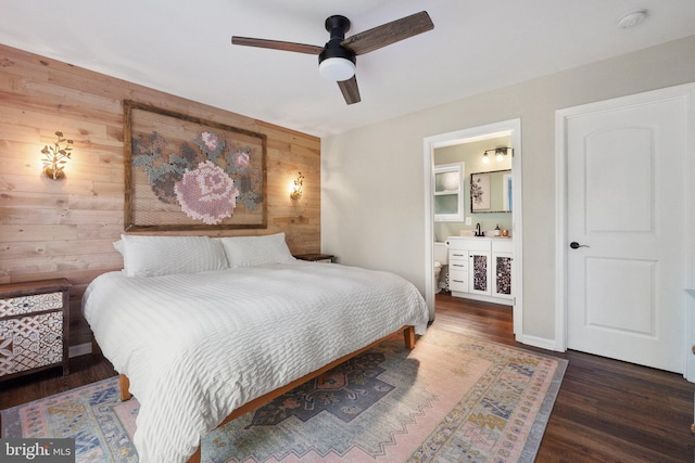 1820 Gooney Manor Loop, Bentonville, VA 22610 - bedroom featuring wooden walls, wood finished floors, ensuite bathroom, and a ceiling fan