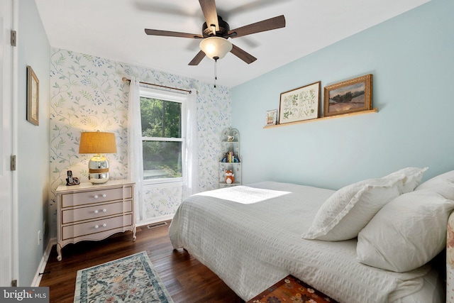 1820 Gooney Manor Loop, Bentonville, VA 22610 - bedroom featuring wallpapered walls, dark wood finished floors, baseboards, and ceiling fan