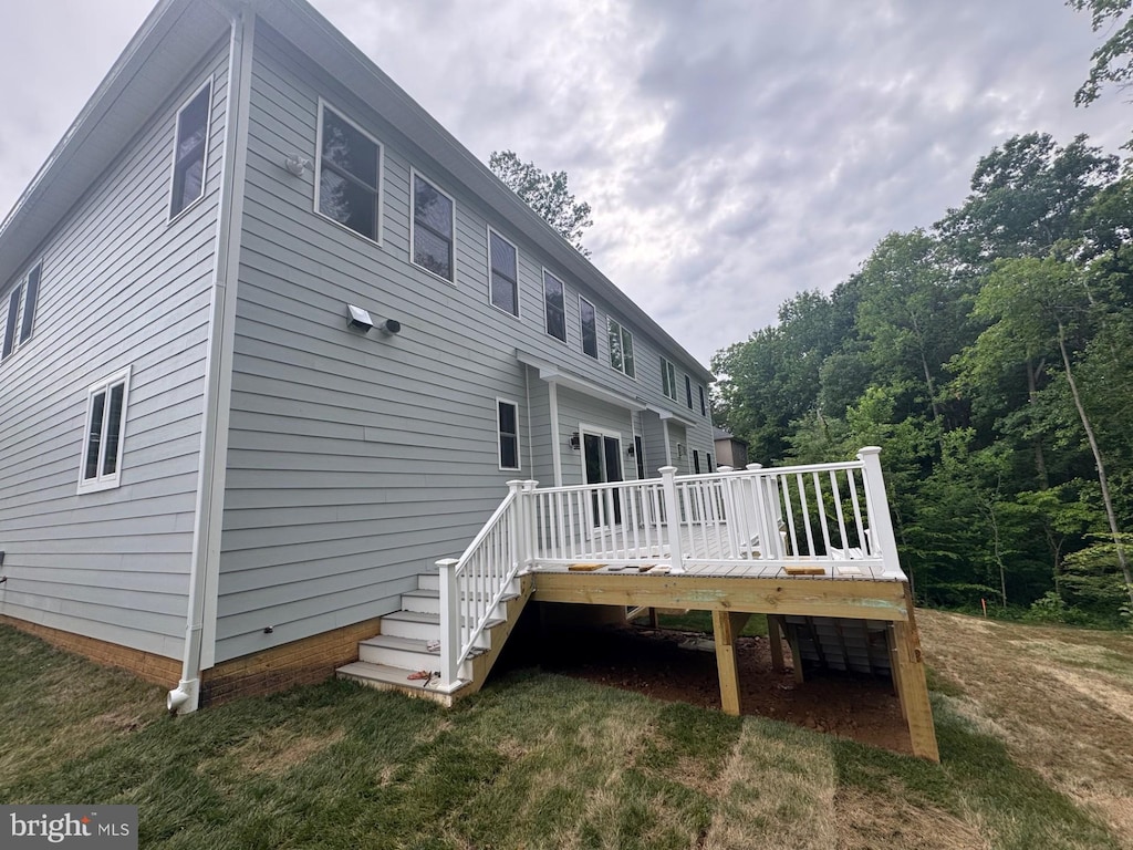 7215 Oriole Ave, Springfield, VA 22150 - back of property with a deck, a yard, and stairs