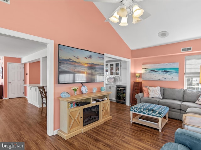 132 Seabright Way Unit D5, Rehoboth Beach, DE 19971 - living area with wine cooler, high vaulted ceiling, wood finished floors, a ceiling fan, and bar