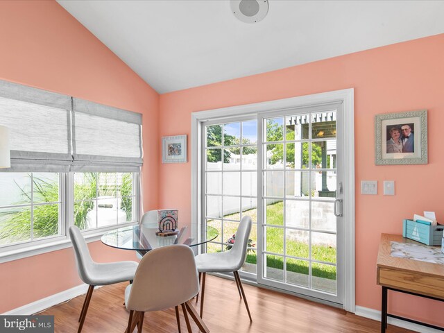 132 Seabright Way Unit D5, Rehoboth Beach, DE 19971 - dining room with vaulted ceiling, wood finished floors, and baseboards