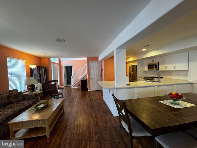 132 Seabright Way Unit D5, Rehoboth Beach, DE 19971 - living room with dark wood-style flooring and stairs