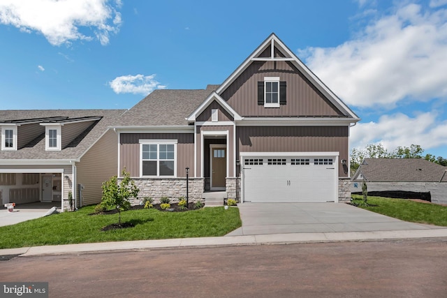 19 Gentle Slope Way, Gettysburg, PA 17325 - craftsman house with stone siding, concrete driveway, board and batten siding, and a front lawn