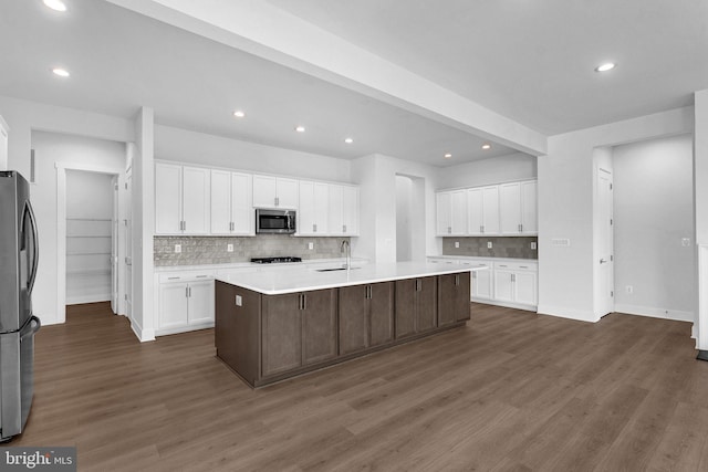 19 Gentle Slope Way, Gettysburg, PA 17325 - kitchen featuring appliances with stainless steel finishes, a sink, backsplash, light countertops, and white cabinetry