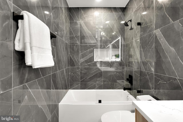 2305 Nicholson St SE Unit 305, Washington, DC 20020 - bathroom with tile walls, shower / washtub combination, vanity, and toilet