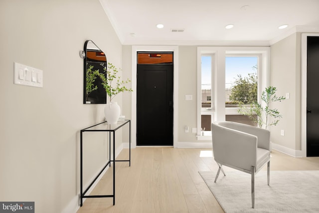 2305 Nicholson St SE Unit 305, Washington, DC 20020 - foyer featuring ornamental molding, baseboards, light wood-style floors, and recessed lighting