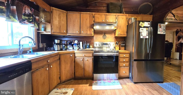 453 Mountain Heights Rd, Front Royal, VA 22630 - kitchen featuring stainless steel appliances, range hood, a sink, brown cabinetry, and light wood-style floors