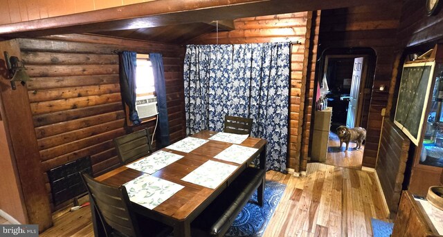 453 Mountain Heights Rd, Front Royal, VA 22630 - dining space featuring rustic walls, wood-type flooring, wooden walls, and cooling unit