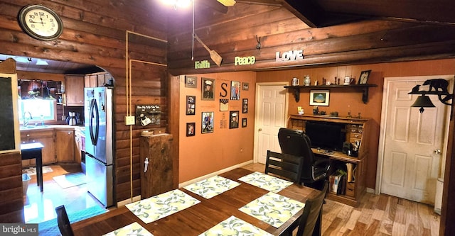 453 Mountain Heights Rd, Front Royal, VA 22630 - office space with rustic walls, arched walkways, light wood finished floors, a sink, and a ceiling fan