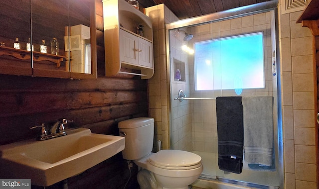 453 Mountain Heights Rd, Front Royal, VA 22630 - bathroom featuring a sink, a stall shower, toilet, and log walls