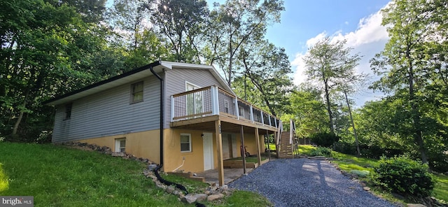 453 Mountain Heights Rd, Front Royal, VA 22630 - view of property exterior featuring stairs, a deck, and gravel driveway