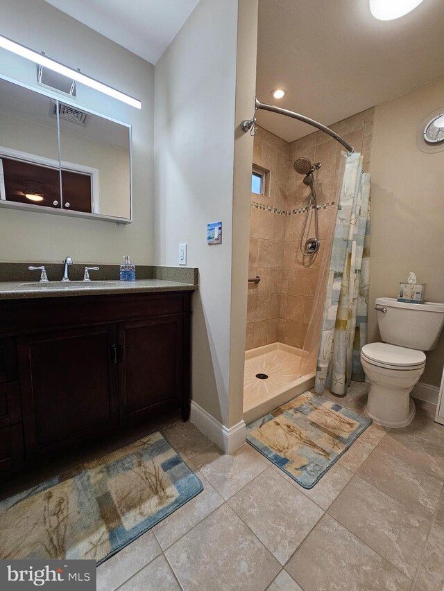 57 Finchley Ct, Southampton, NJ 08088 - full bathroom with a stall shower, toilet, vanity, baseboards, and tile patterned flooring