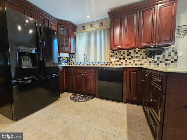 57 Finchley Ct, Southampton, NJ 08088 - kitchen with black appliances, decorative backsplash, light countertops, a sink, and light tile patterned floors