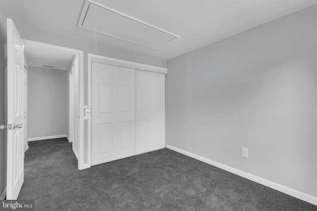 31 Ewing Dr Unit C, Reisterstown, MD 21136 - unfurnished bedroom with attic access, dark carpet, and a closet